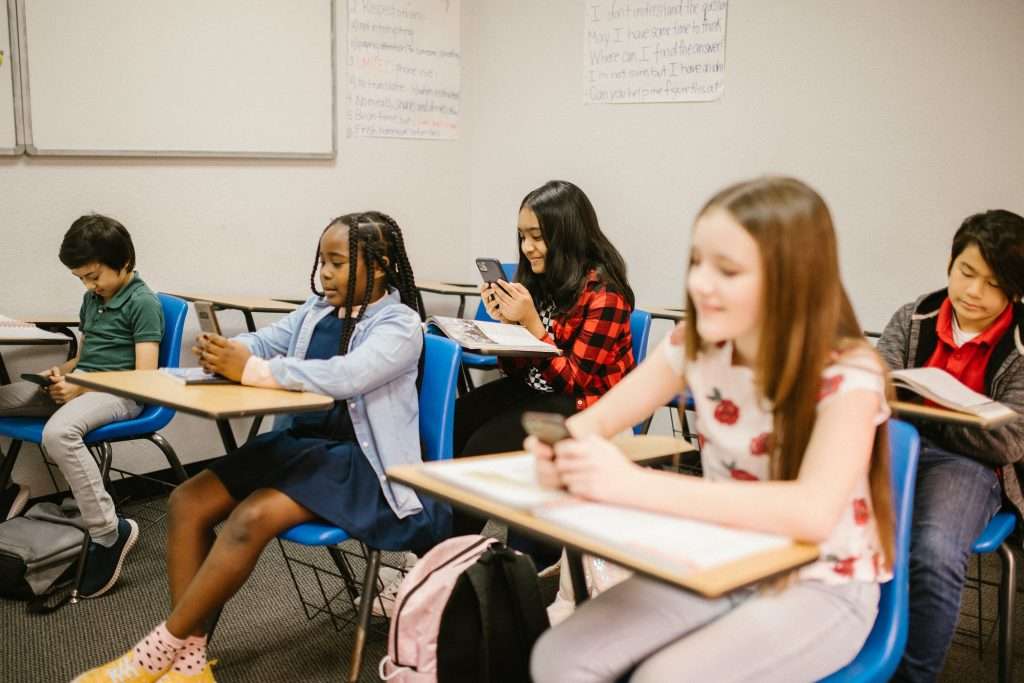 Students in a Class Busy on their mobiles